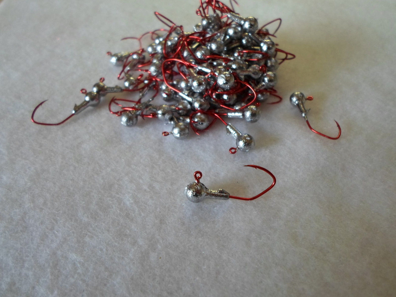 35ct. - 1/16oz. Cam's Unpainted Round Head w/#4 Sickle Red((Laser Sharp)Nasty Bend Hooks
